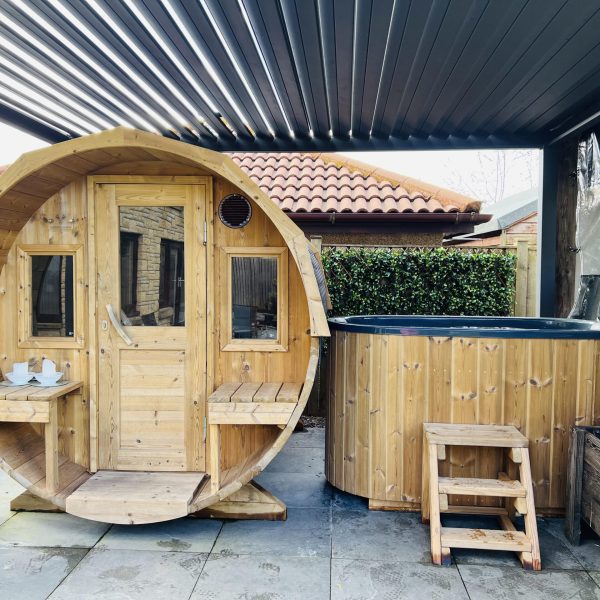 cold plunge bath beside barrel sauna