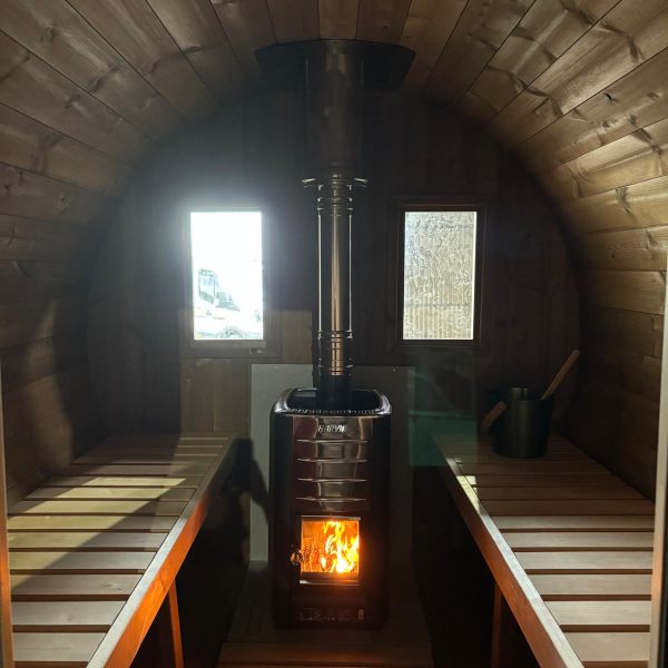 mobile sauna interior with wood burning heater