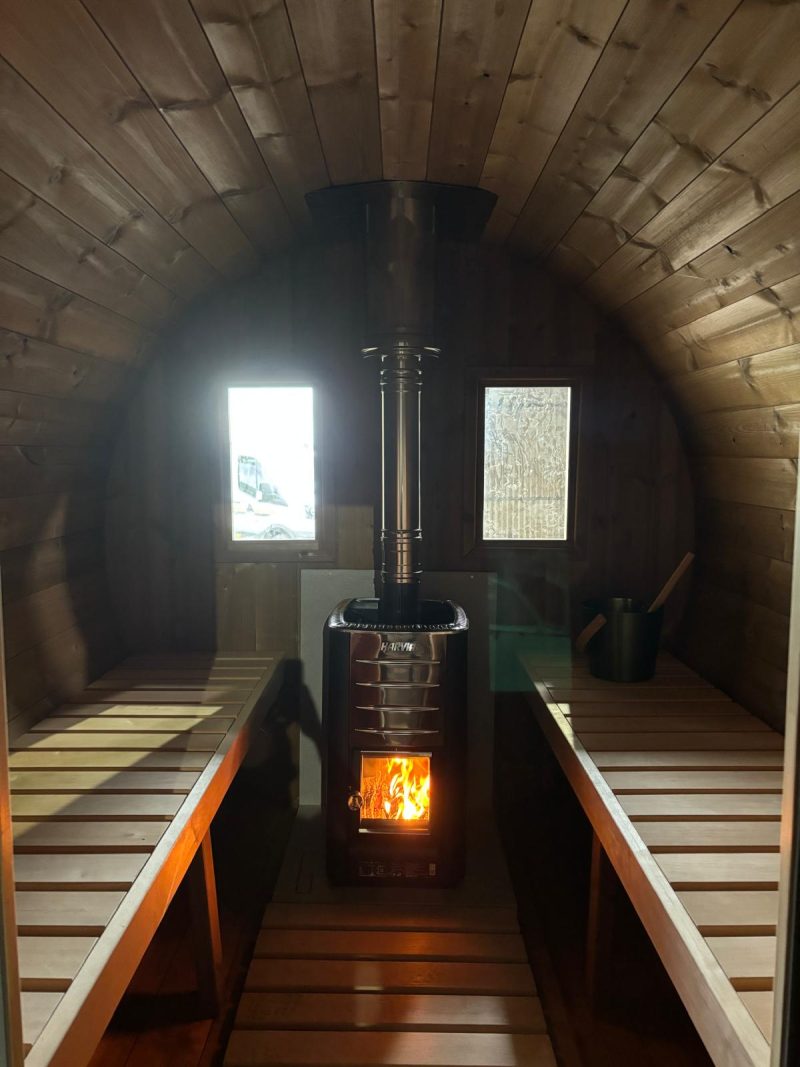mobile sauna interior with wood burning heater